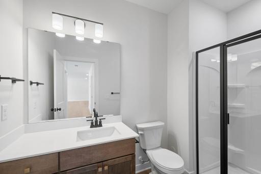 Lower level 3/4 bathroom *Photo of similar home