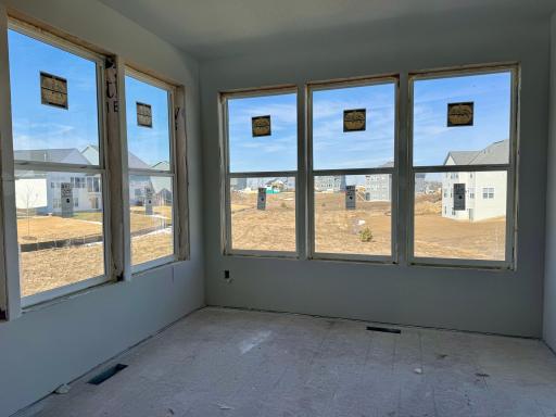 View of the backyard out the upper level sunroom looking straight back