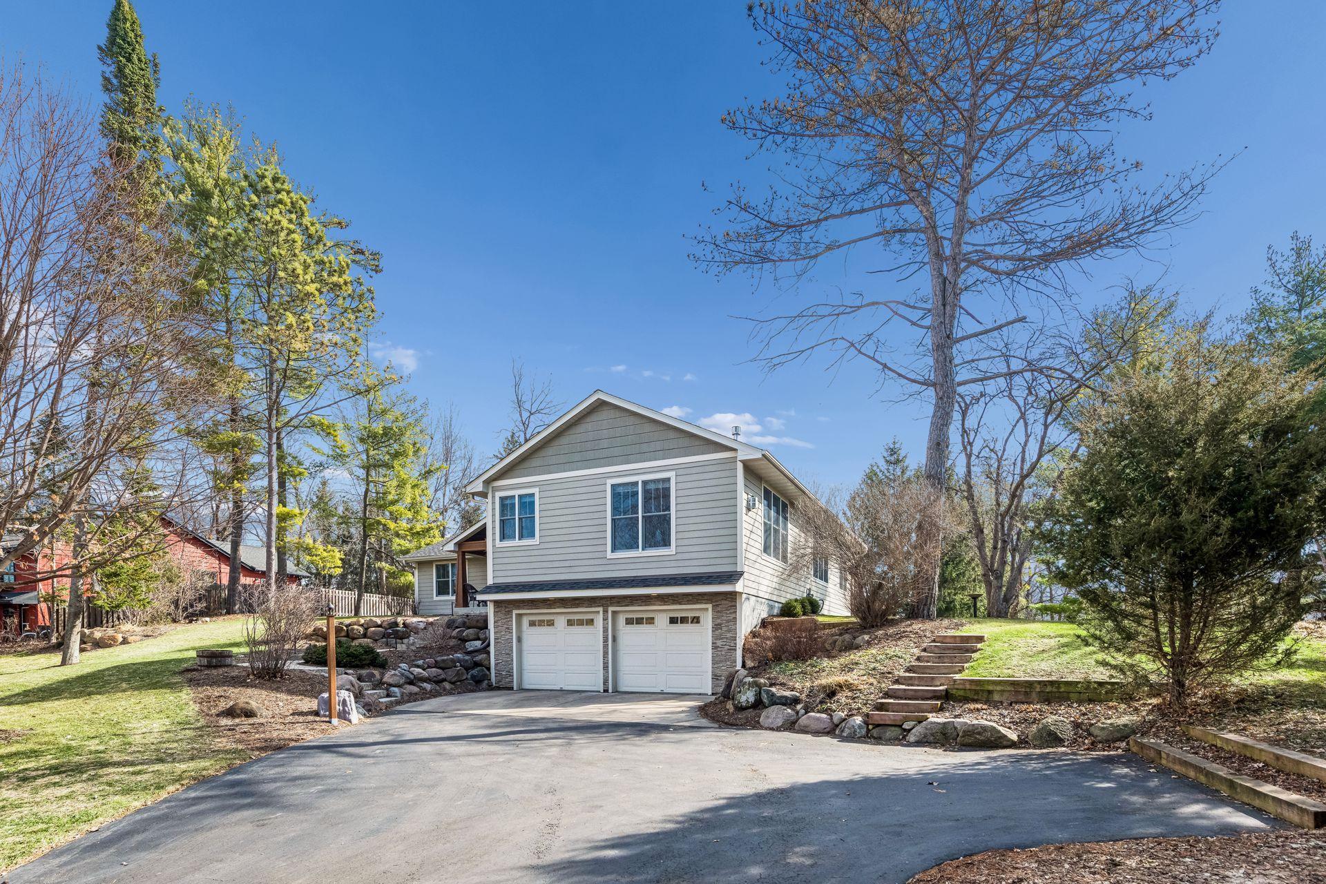 450 Willow Drive S. - Beautifully landscaped yard with boulder retaining walls, and stone steps. In ground irrigation system - Green Lawn