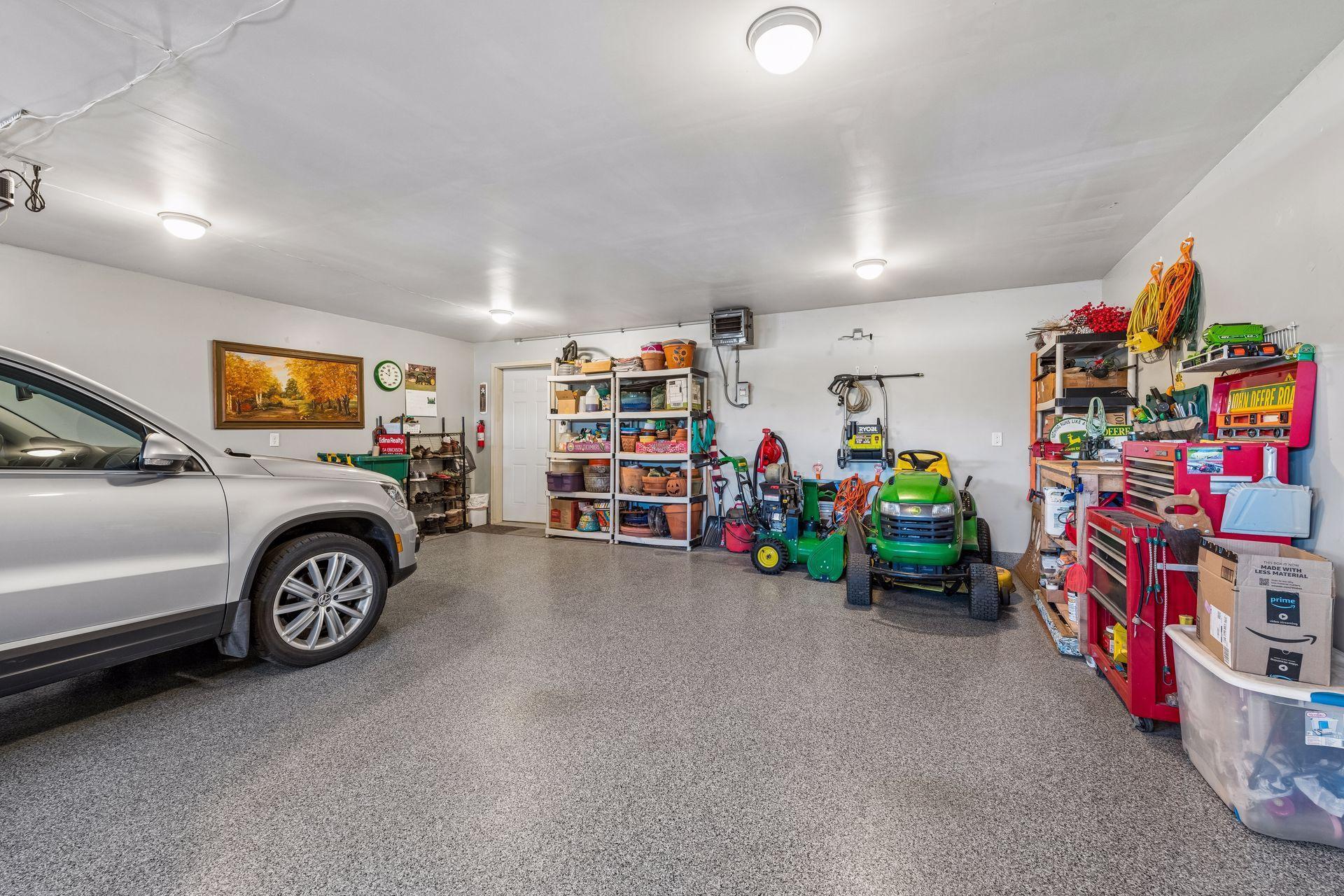 You'll like the fact that this garage is heated and insulated. The garage floor has a professional garage floor coating. Garage is 22'1"X 25"2". The garage doors are 7 ft. in height and 9 ft. in width. 2 new Liftmaster garage door openers- 2024-2025