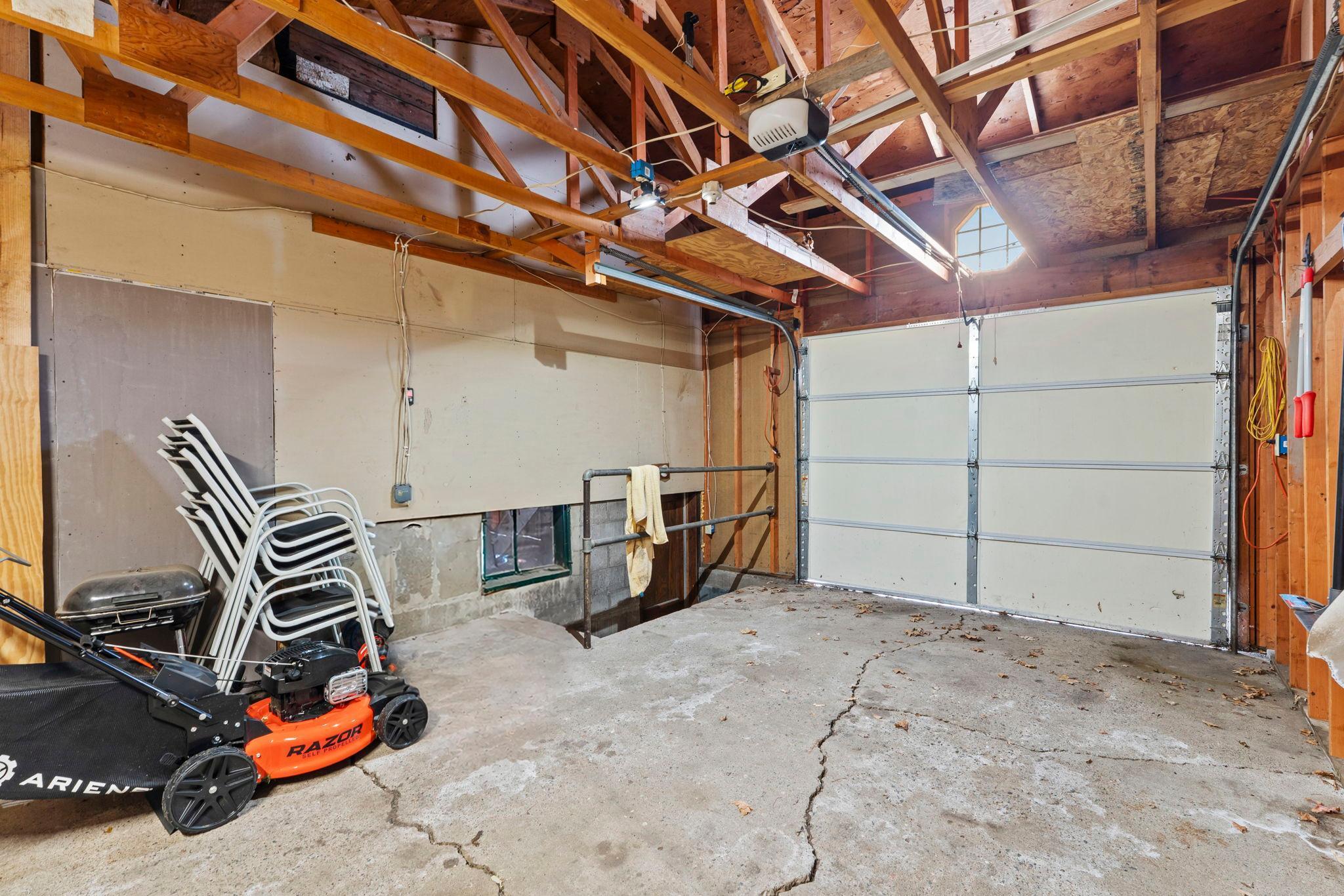 Garage with stairs to enter the basement