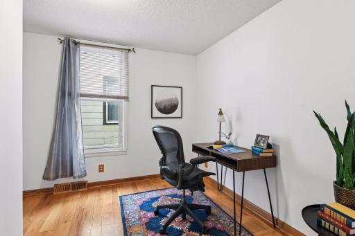 Main floor bedroom with French doors has a long walk-in closet
