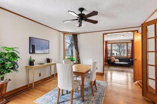 Large dining room with hardwood floors and inlay pattern