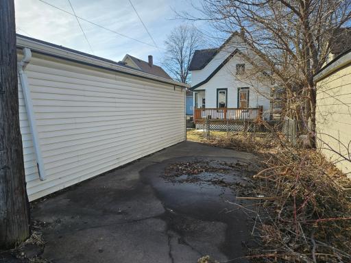 Extra parking pad next to garage.