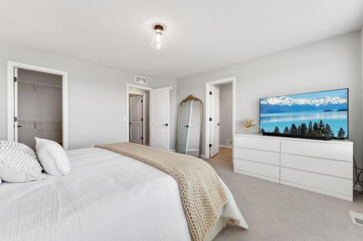 Primary features a private 3/4 bath and walk-in closet