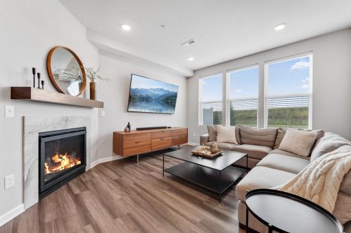 Family room with large windows and gas fireplace