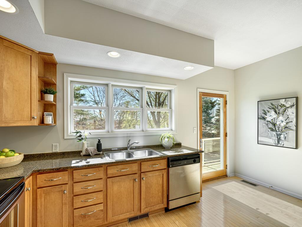 Kitchen with large window and deck walkout