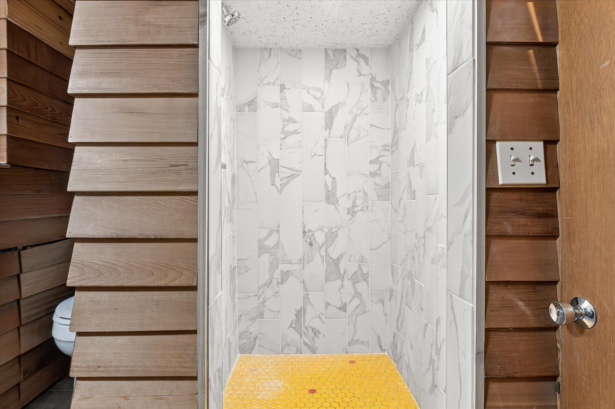 Tiled Shower in the Lower Level Bath
