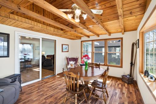 Right off the living room is this amazing sun room/dining area with views from every window!