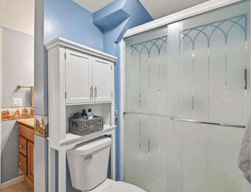 Lower level bath with a shower, convenient for running in from the lake!