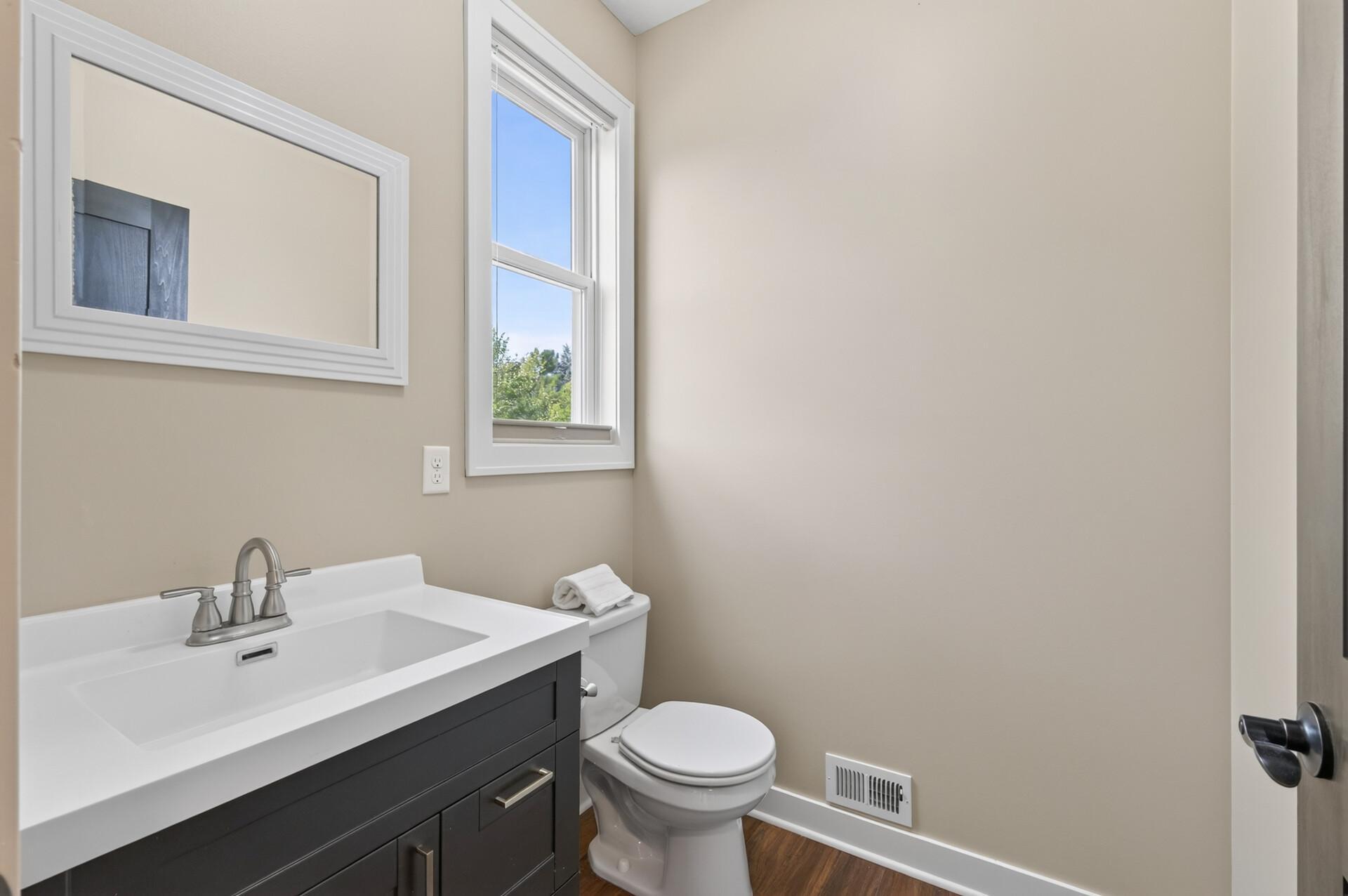 A convenient main-level powder room is perfect for guests.