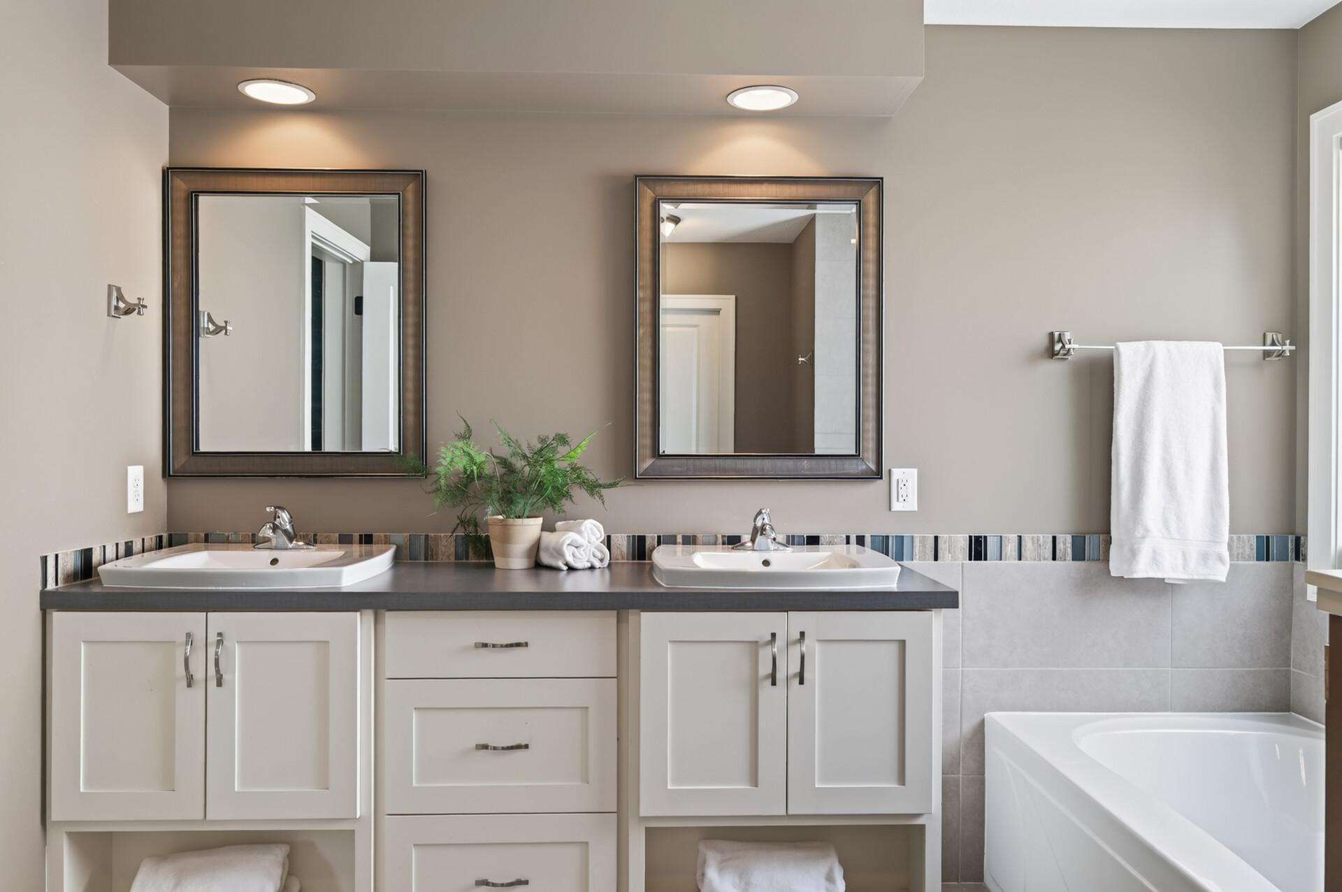 Dual vanities provide extra storage and convenience for busy mornings.