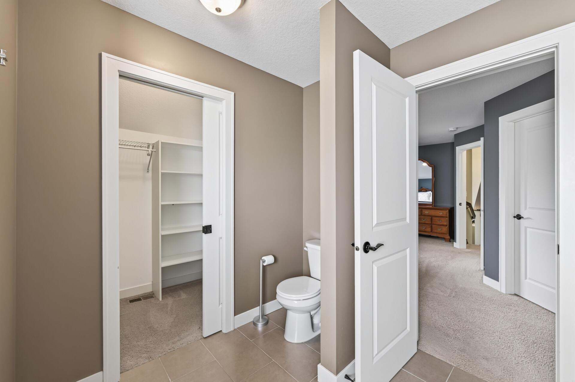 The private ensuite and walk-in closet complete the owner's retreat.