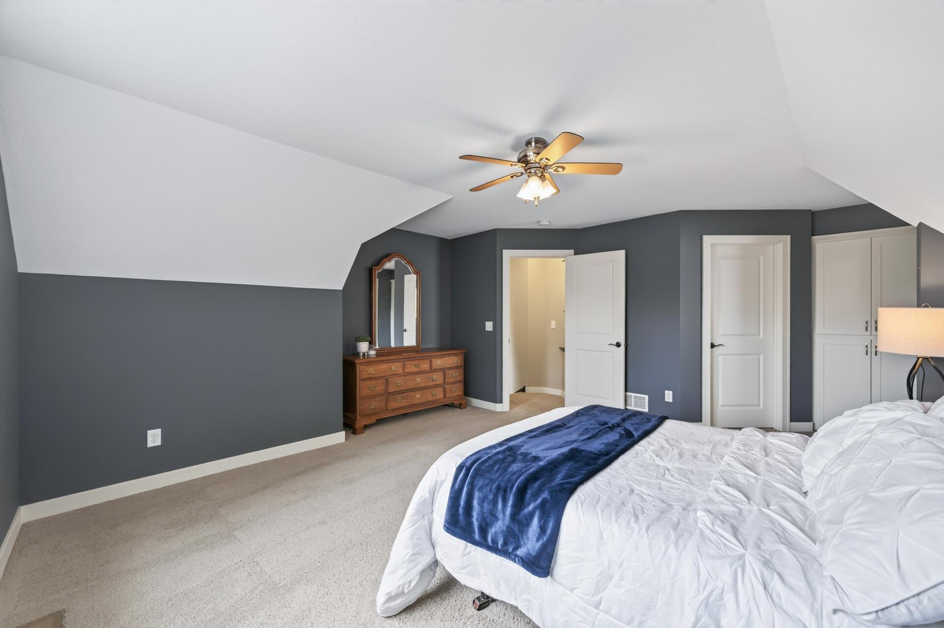Vaulted ceilings add character and an airy feel to the primary suite.