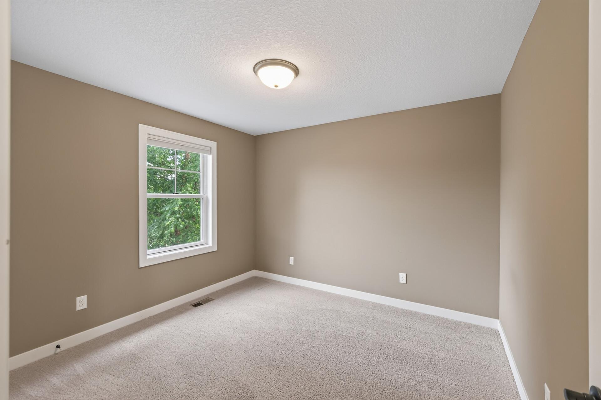 Spacious secondary bedrooms offer comfort for family and guests.