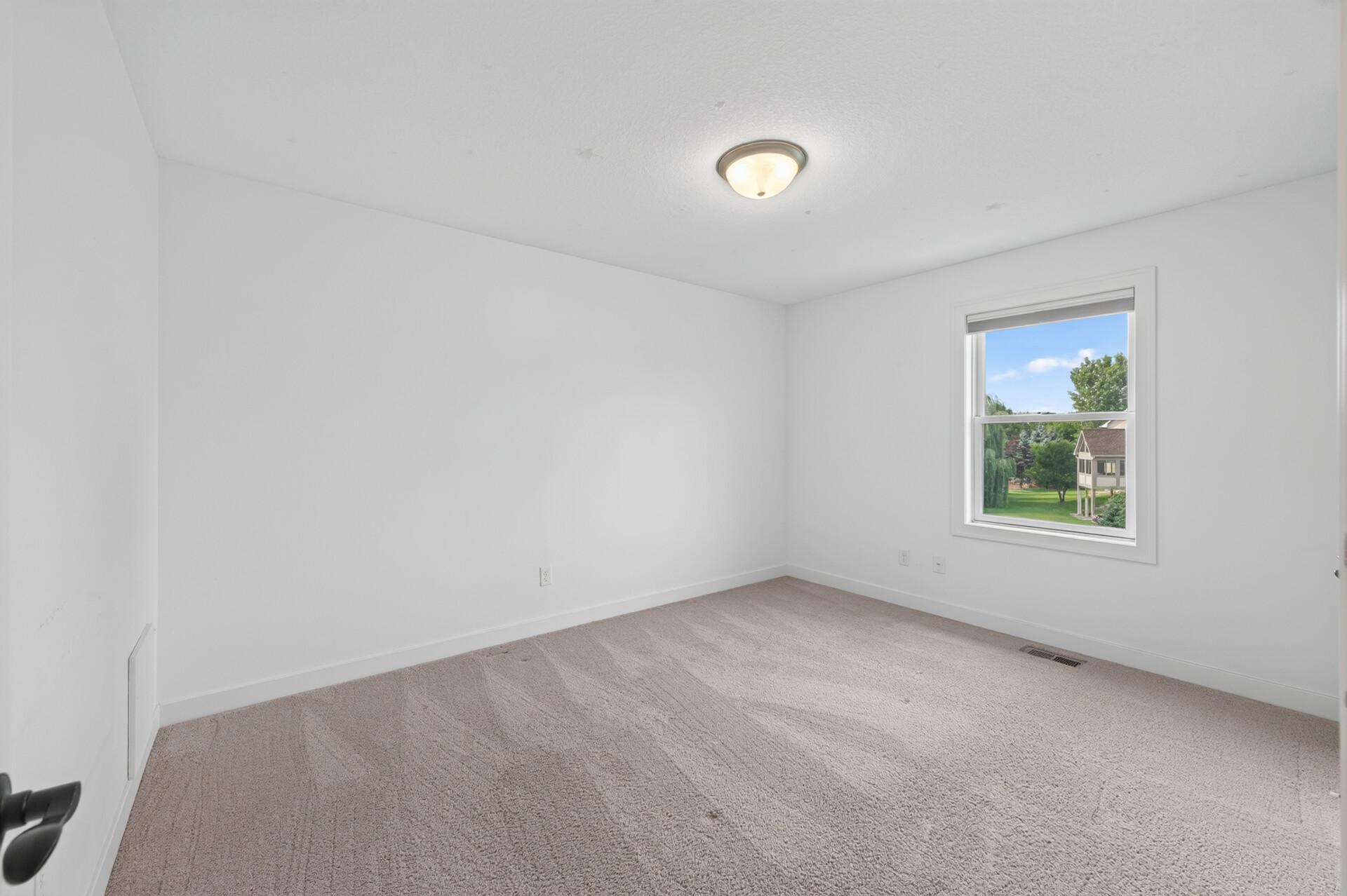 Bright, neutral finishes make this bedroom move-in ready.