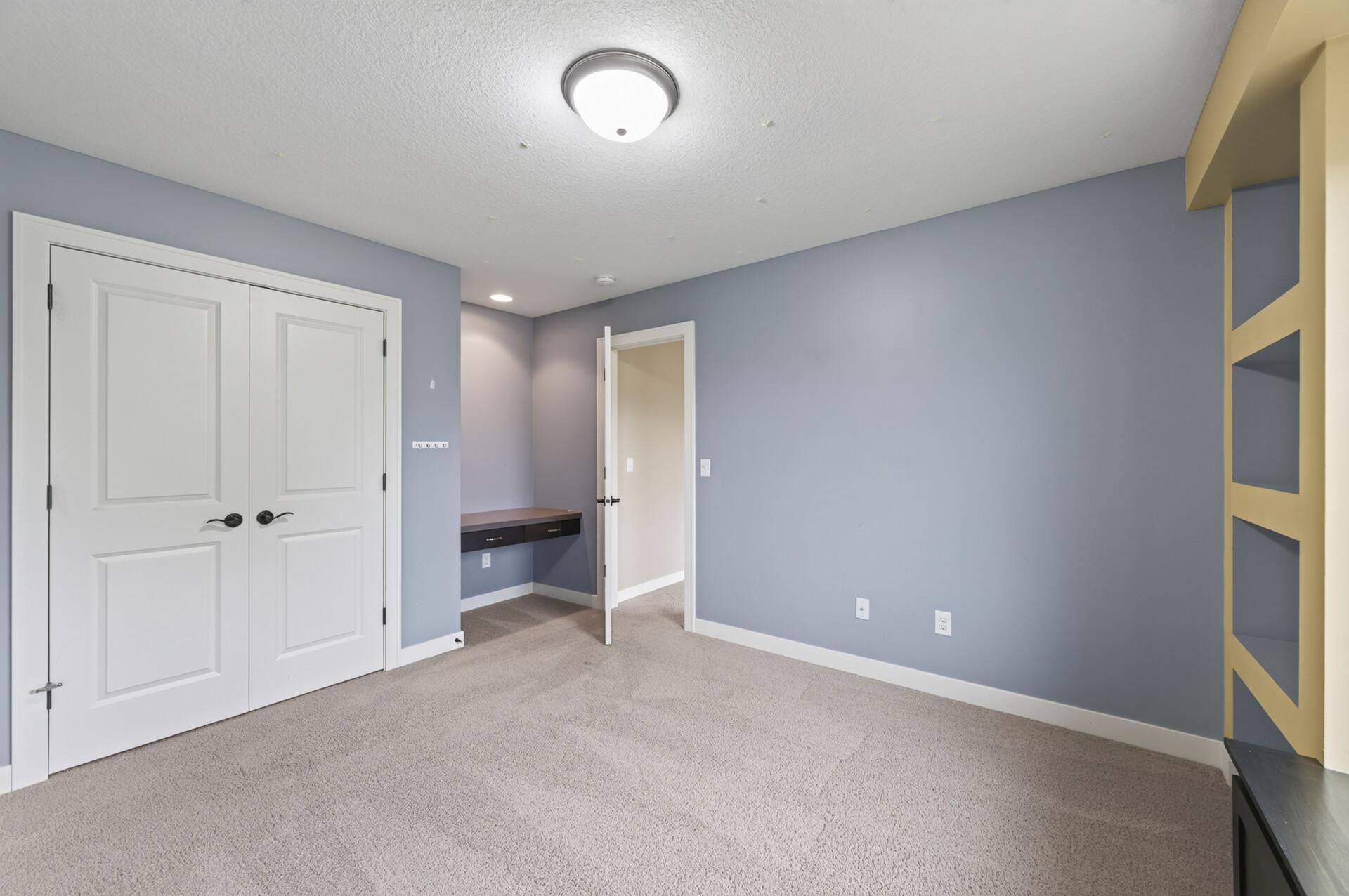 Another spacious bedroom offers room to grow, work, or relax.
