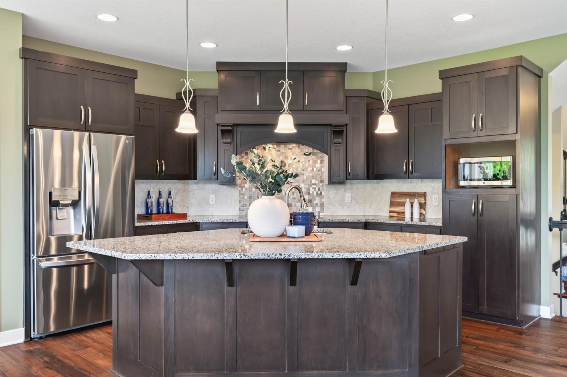 This spacious kitchen offers plenty of storage and room for everyone to gather.