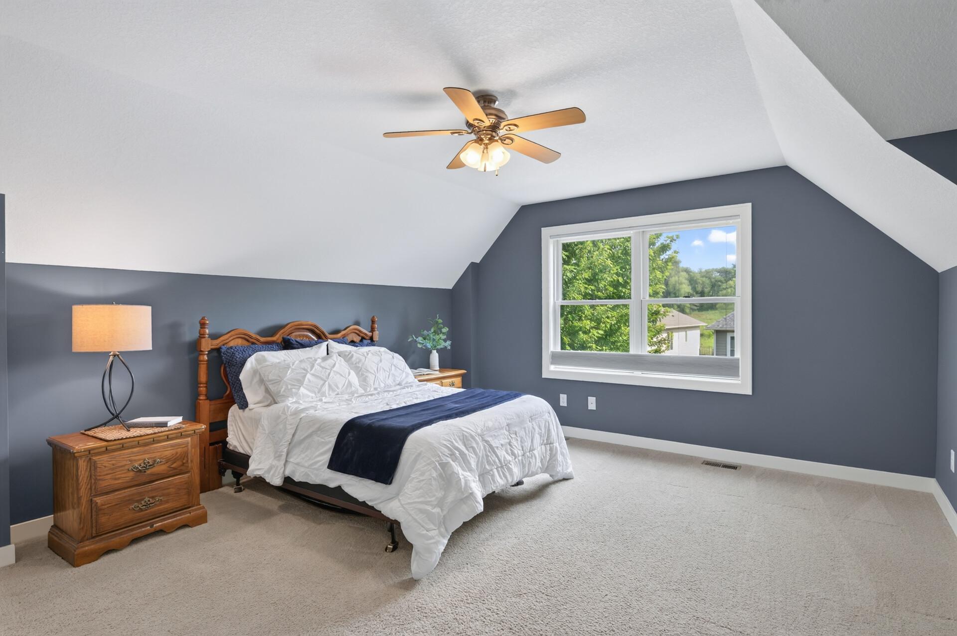 The spacious primary suite offers a peaceful retreat at the end of the day.