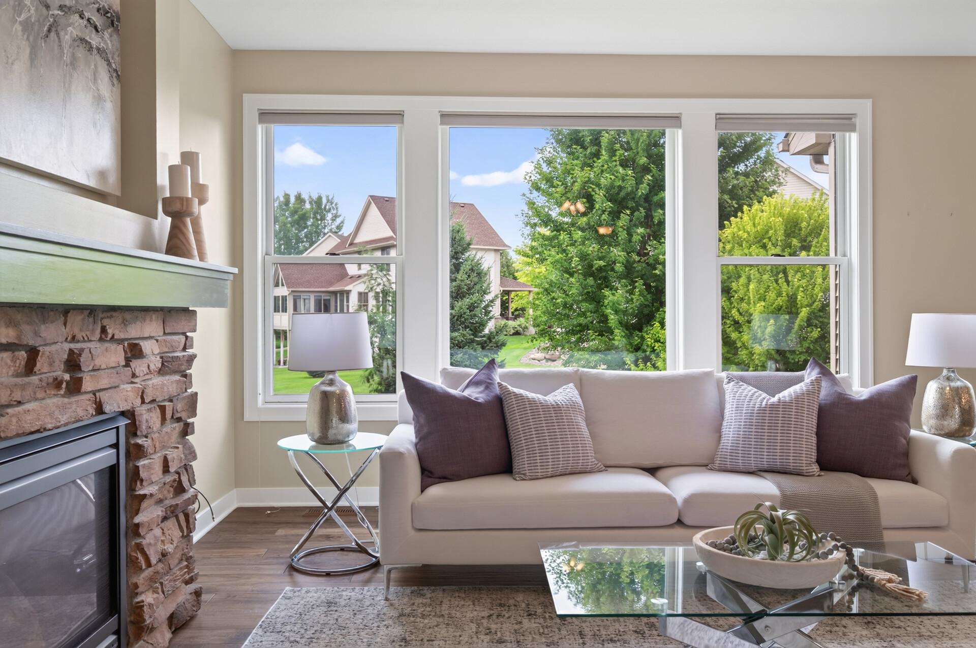 Large picture windows bring the outdoors in while filling the home with sunshine.