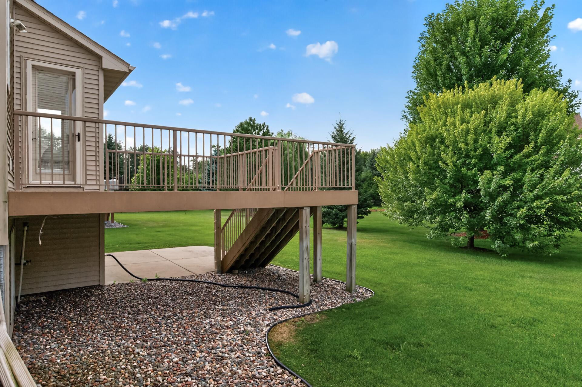 The backyard offers plenty of green space to enjoy all season long.