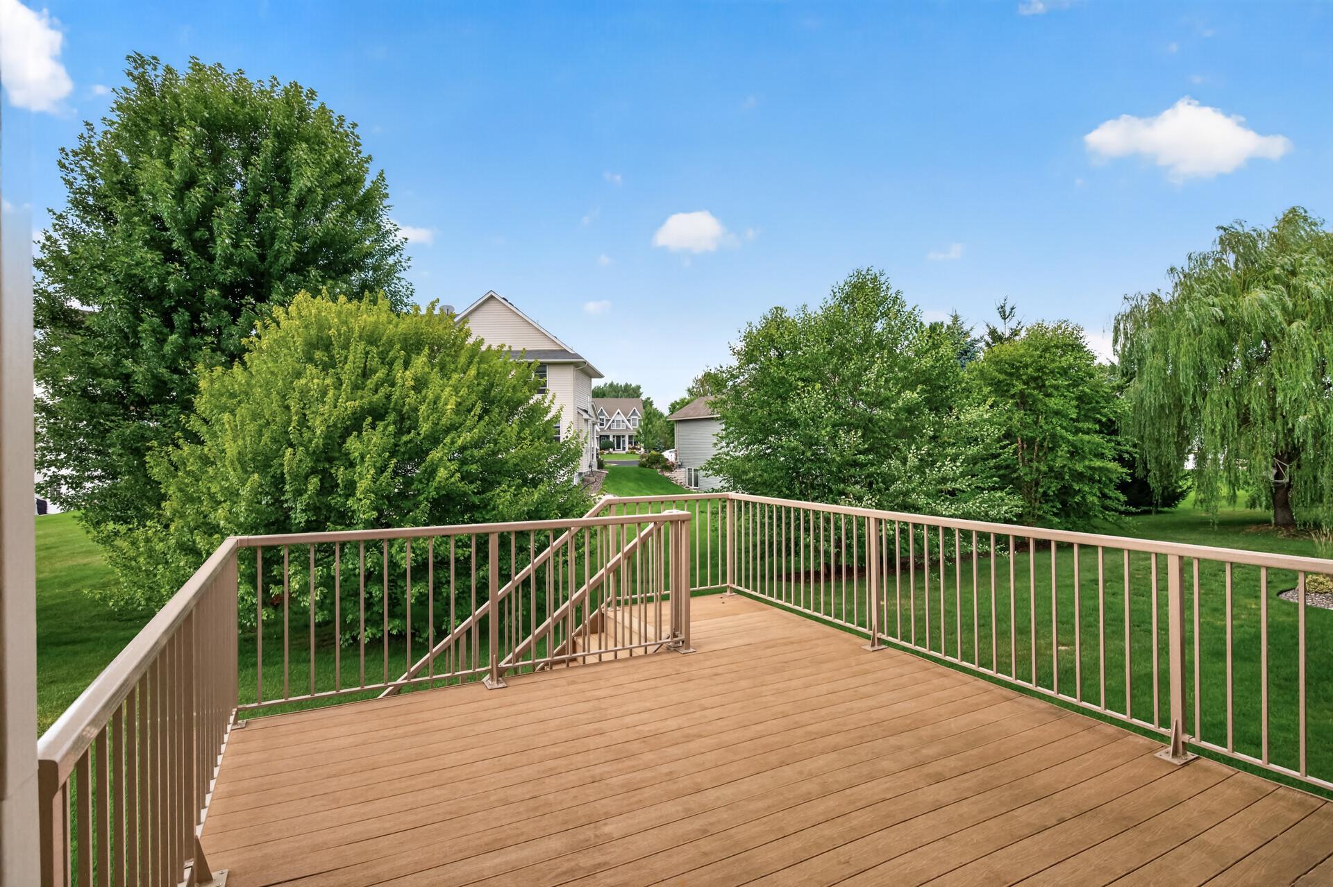 Step outside to a spacious deck overlooking the beautifully landscaped backyard.