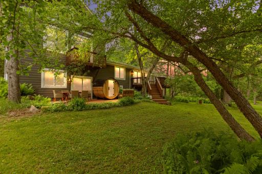 Back of house with deck, patio, sauna, and master balcony
