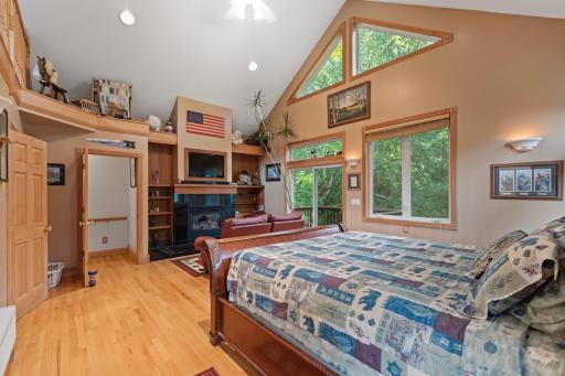 Master suite with vaulted ceilings, huge walk in closet, fireplace, and loft
