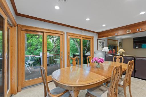 Dining space main floor with access to deck and grill
