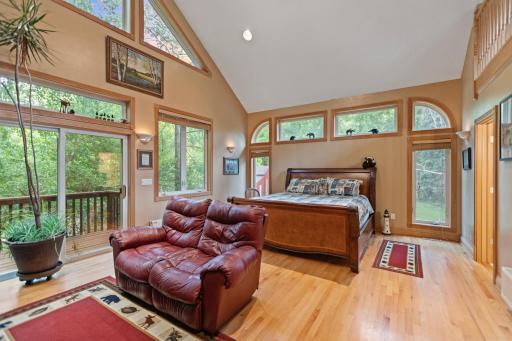 Master suite with vaulted ceilings, huge walk in closet, fireplace, and loft