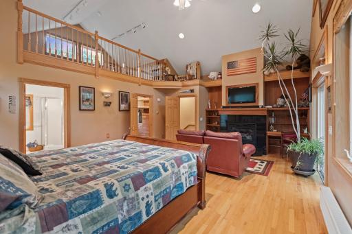 Master suite with vaulted ceilings, huge walk in closet, fireplace, and loft