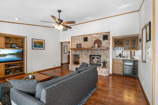 Enjoy cozy evenings by the wood-burning fireplace in the warm family room