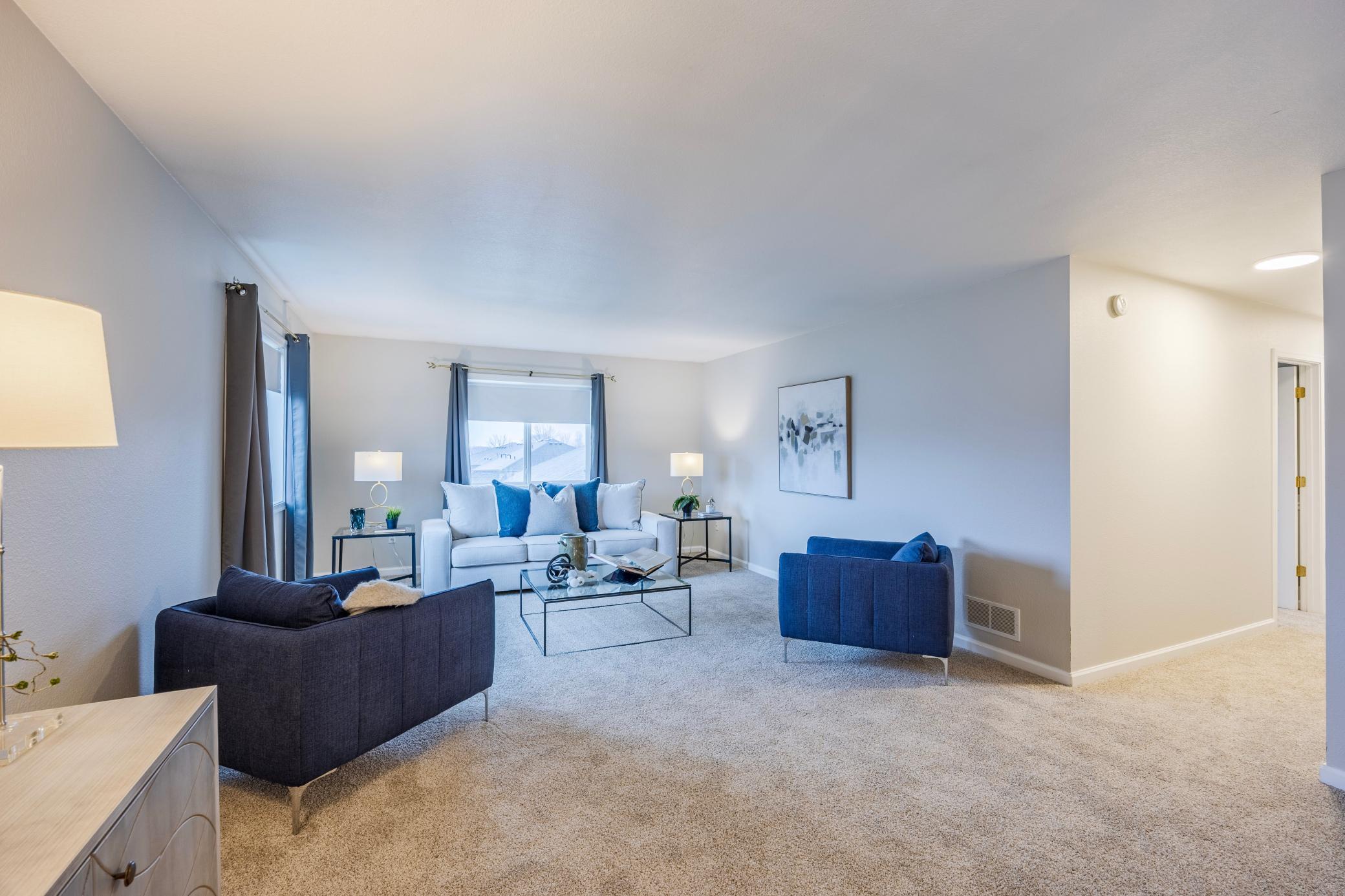 Hallway to primary bedroom with en suite and 2nd bedroom with full guest bath.