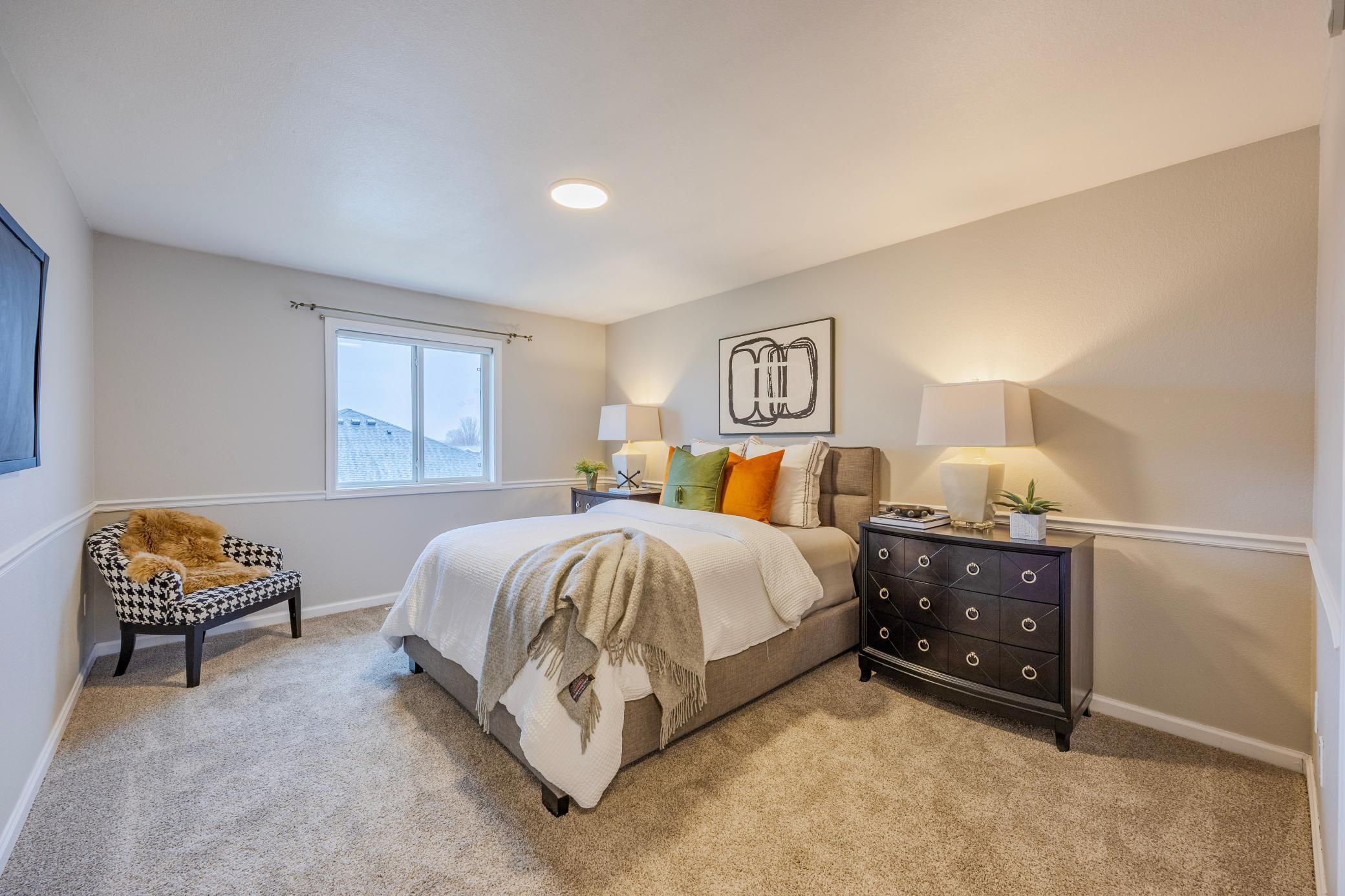 Upstairs primary bedroom with ensuite and large walk-in closet.