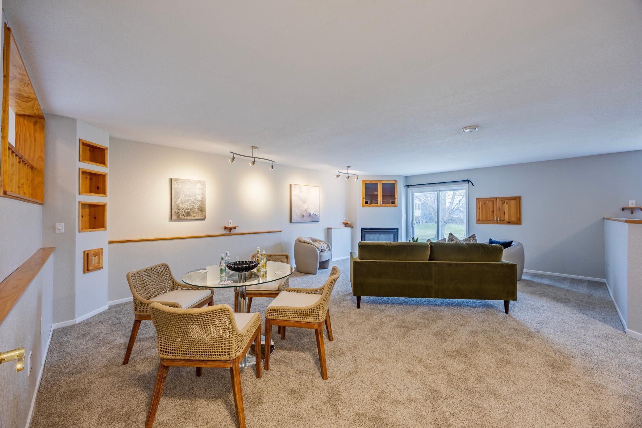 Lower level living room with fireplace and walkout patio.