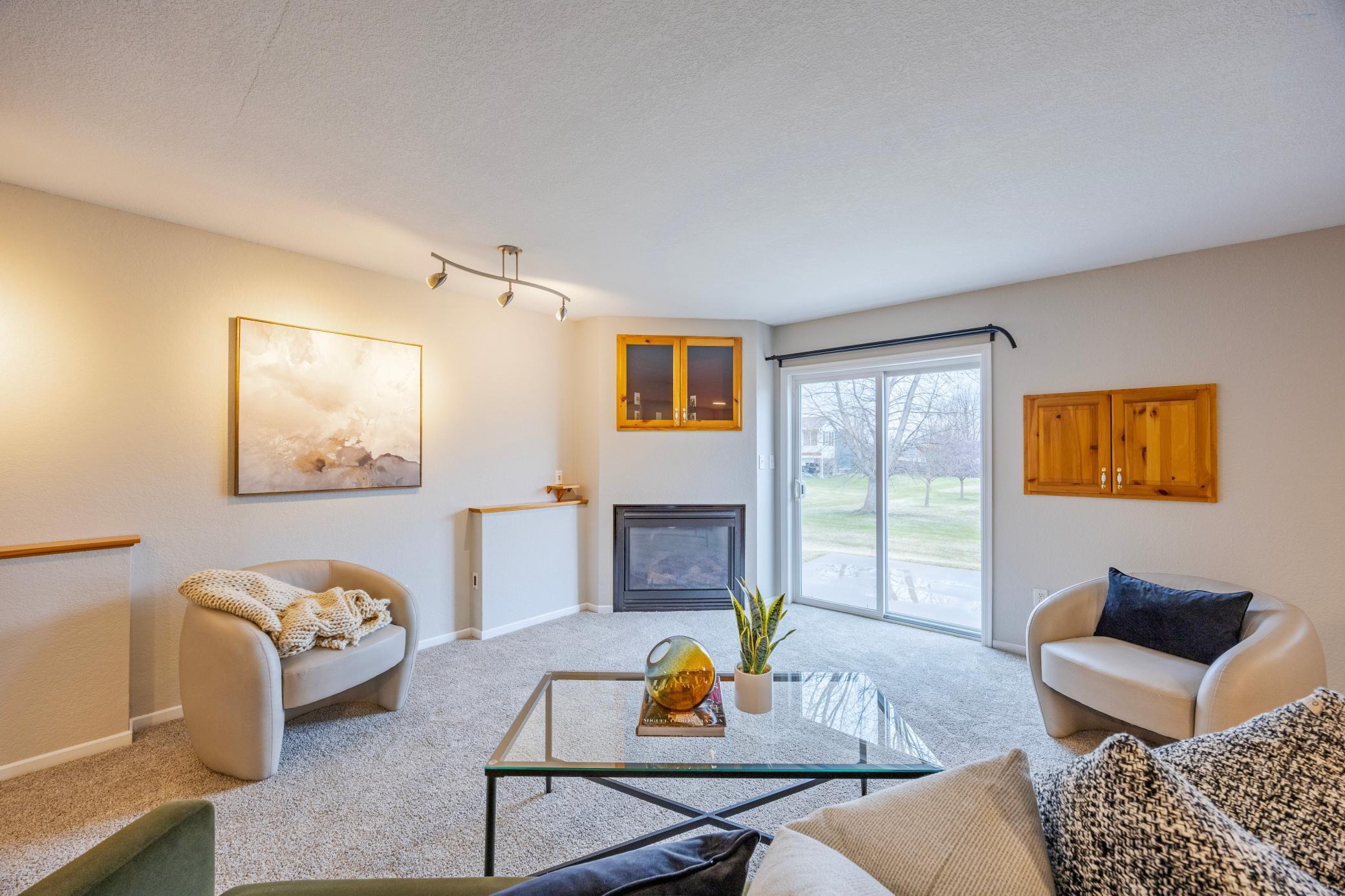 Lower level living room with fireplace and walkout patio.