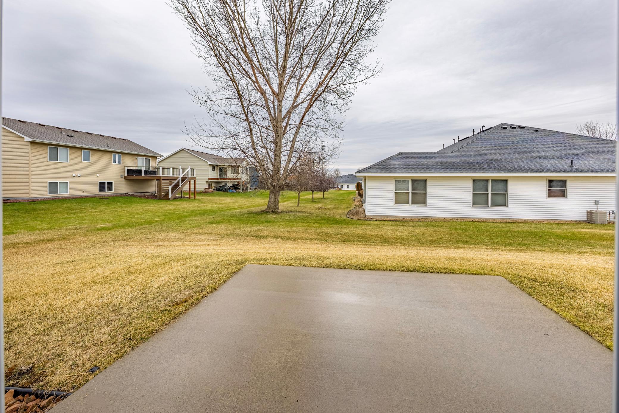 View standing on the walk-out patio of lower level.