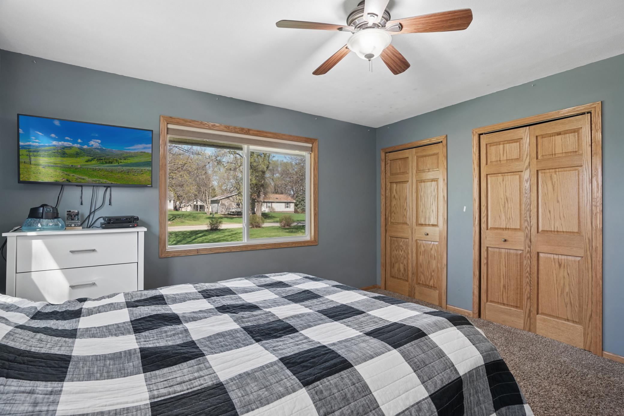 The second main floor bedroom features double closets.