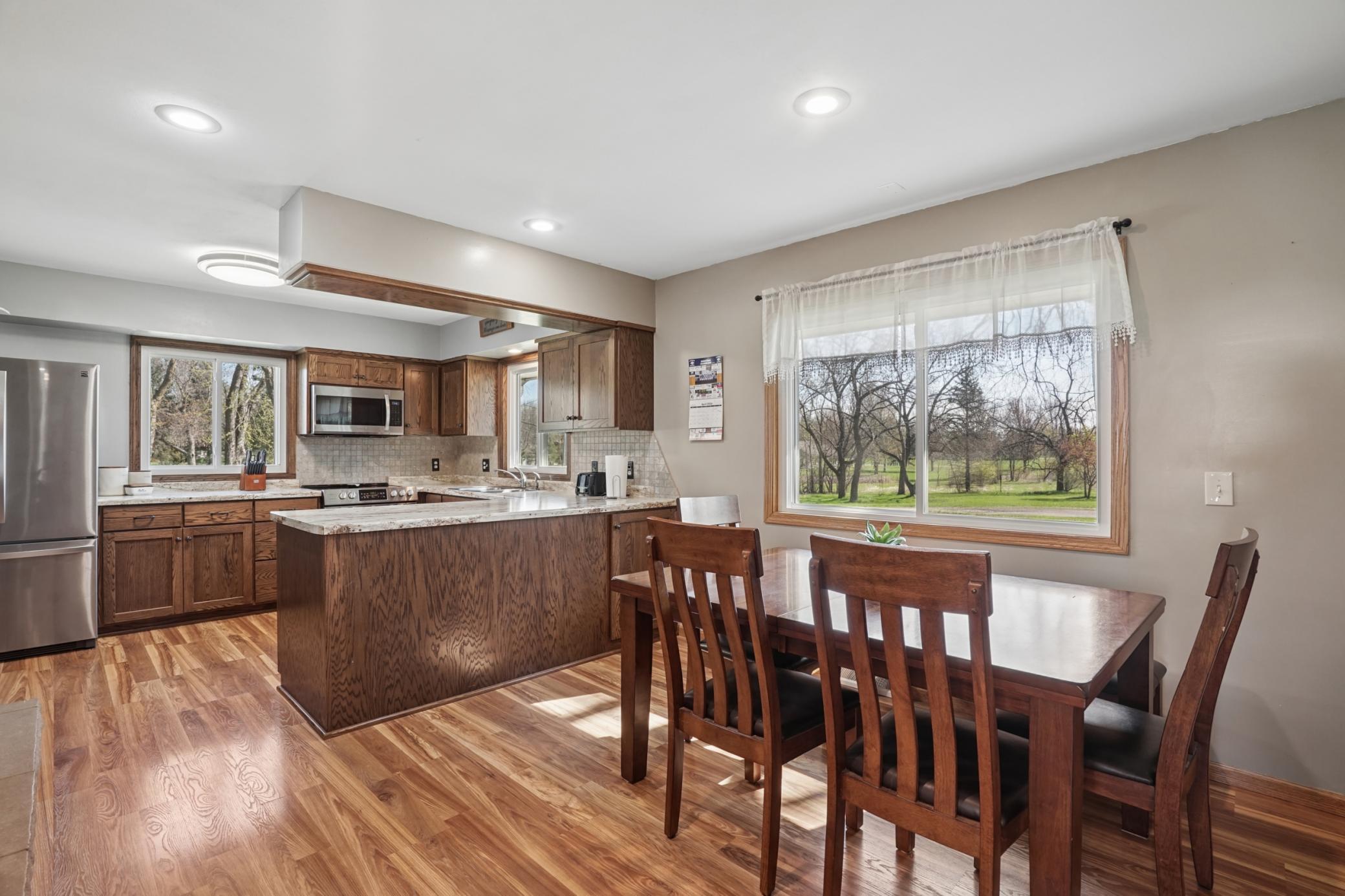 The kitchen features a dining area. Durable LVP flooring is featured throughout the main floor.