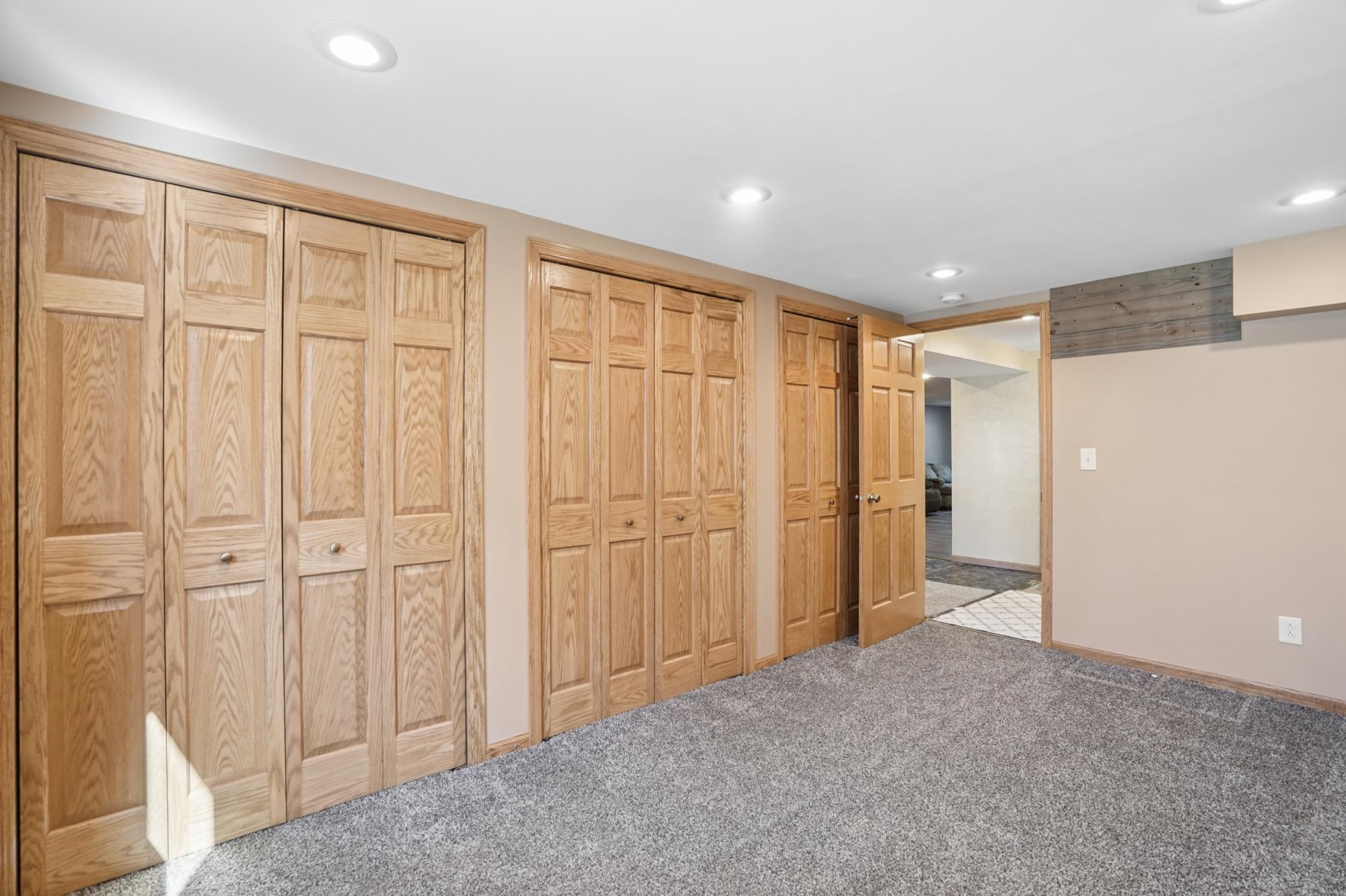 Storage is abundant in the third bedroom with a wall of closets.