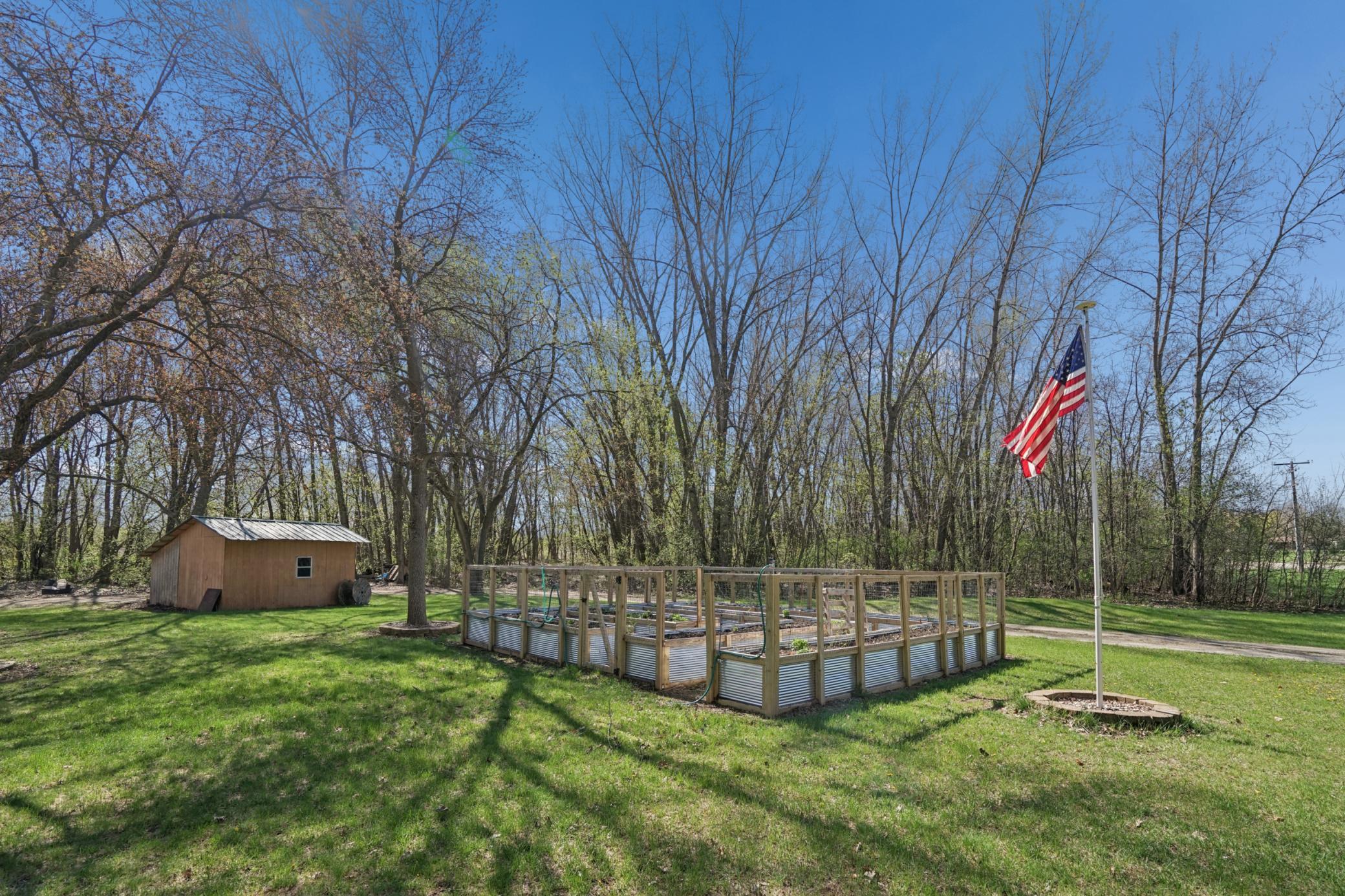 The backyard is a gardeners dream with stunning fenced-in garden beds, ready for spring planting!