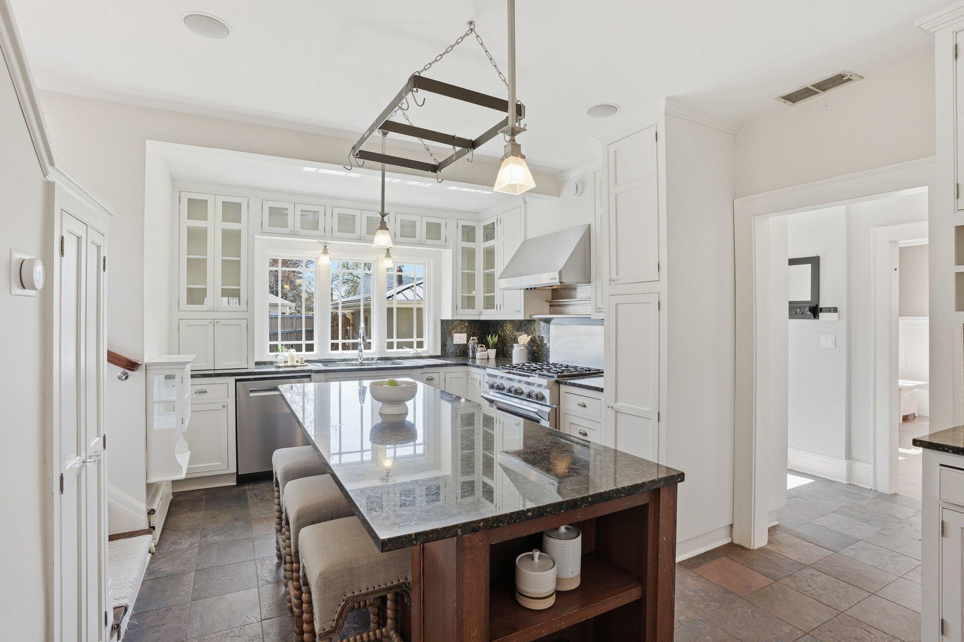 2200 Kenwood Parkway - granite countertops, stainless appliances, a center island make this kitchen attractive and functional.