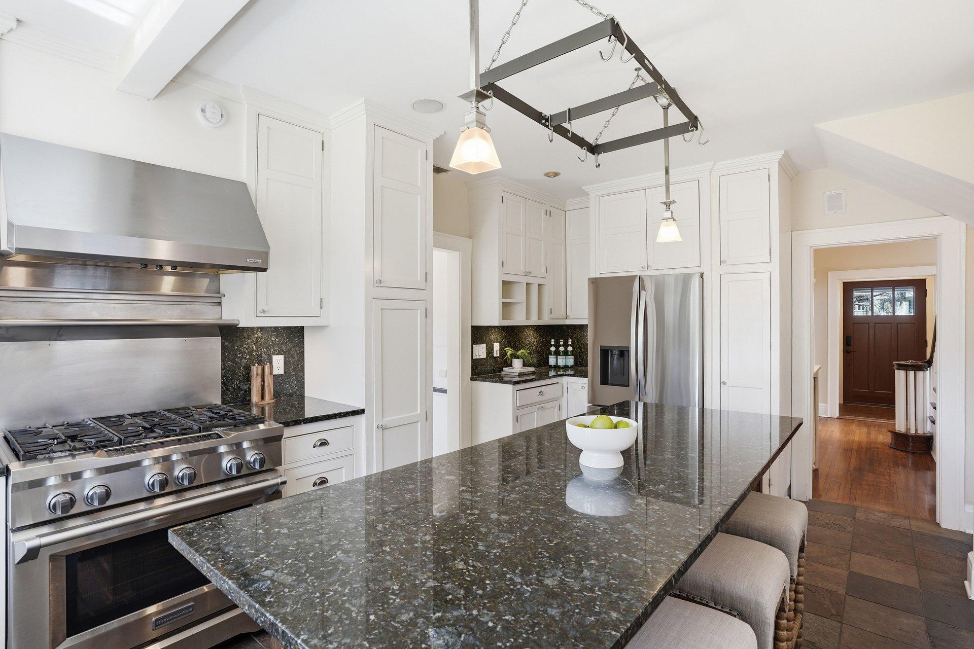 2200 Kenwood Parkway - large center island offers informal seating, granite countertops, and enameled cabinetry with pullout storage