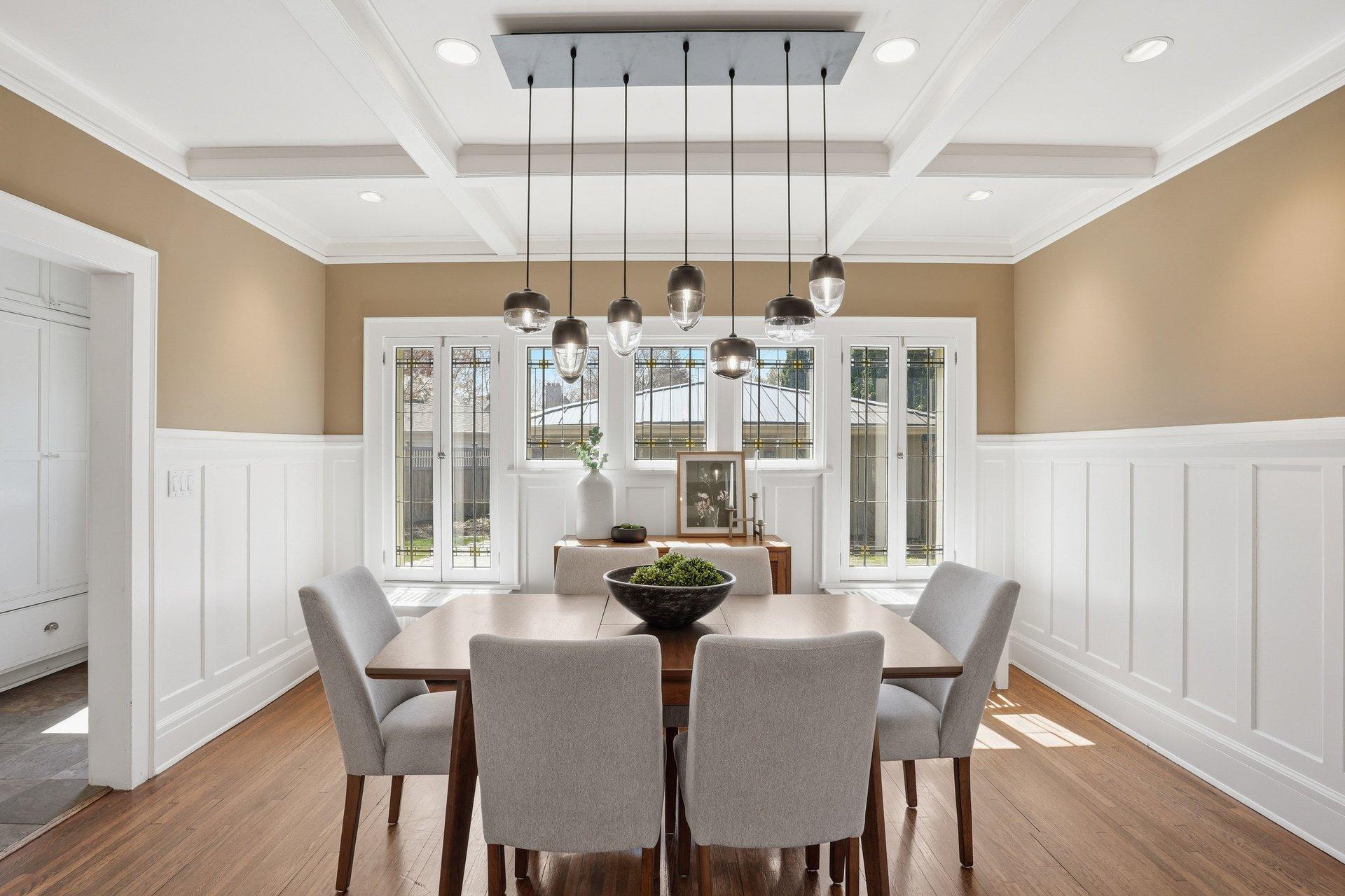 2200 Kenwood Parkway - Formal Dining Room with wainscoting and box beam ceilings offers warm yet elegant dining