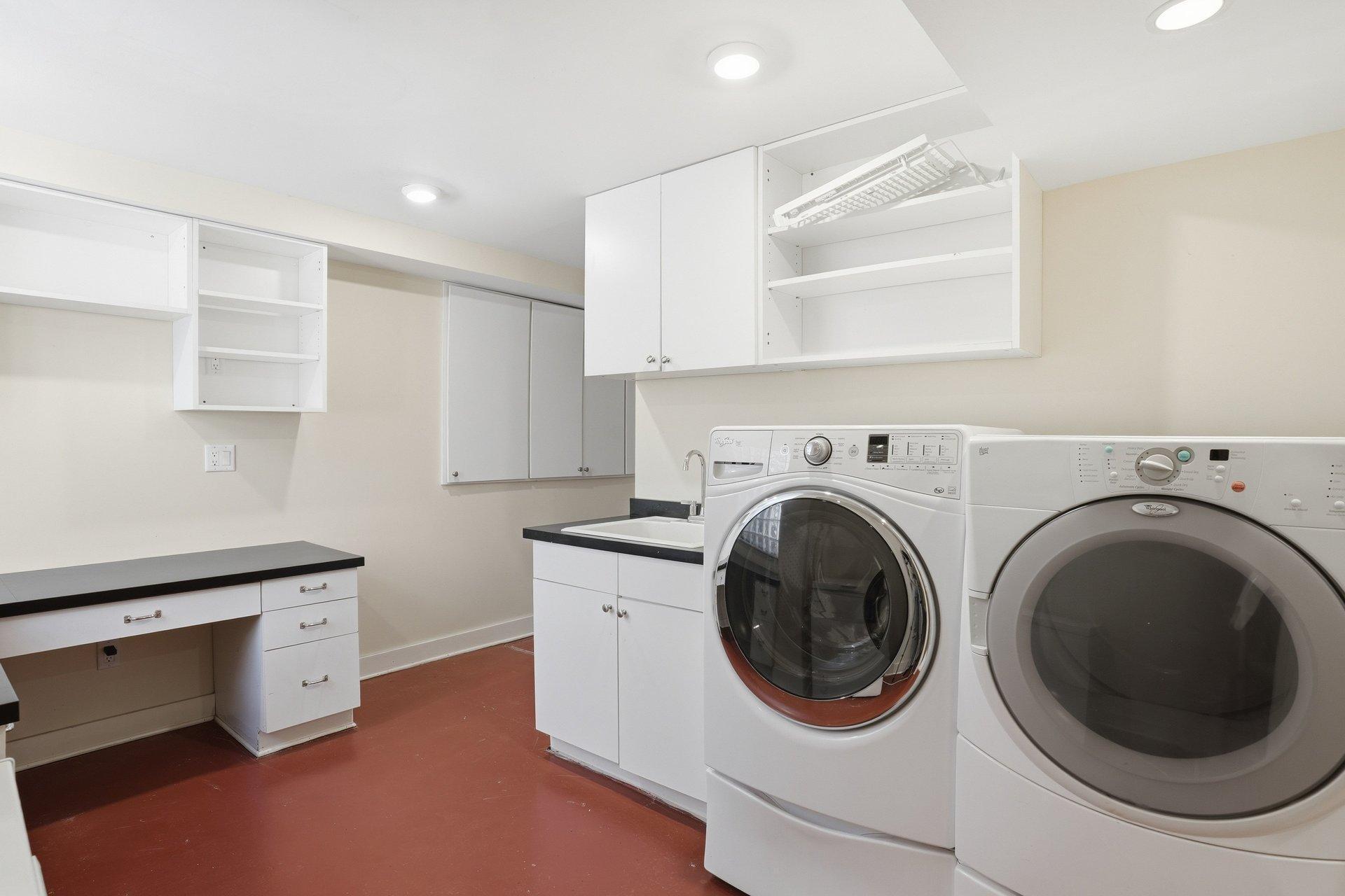 2200 Kenwood Parkway - large laundry room with shelving and countertops for folding clothes