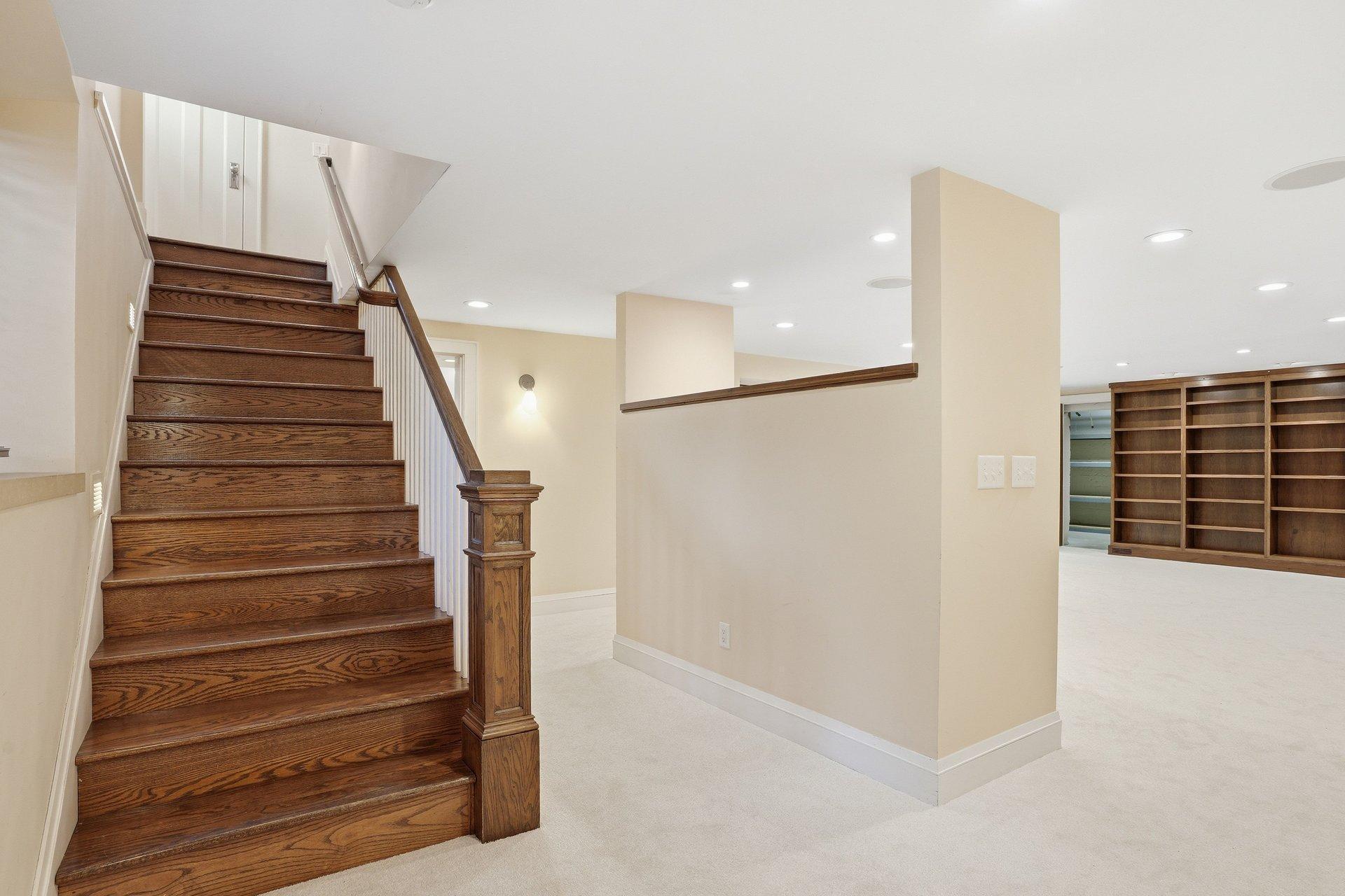 2200 Kenwood Parkway - another beautiful wood staircase brings you to the large, finished lower level