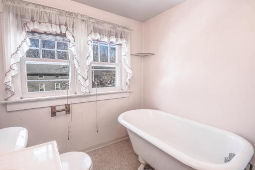 Upstairs bathroom with beautiful clawfoot bathtub.