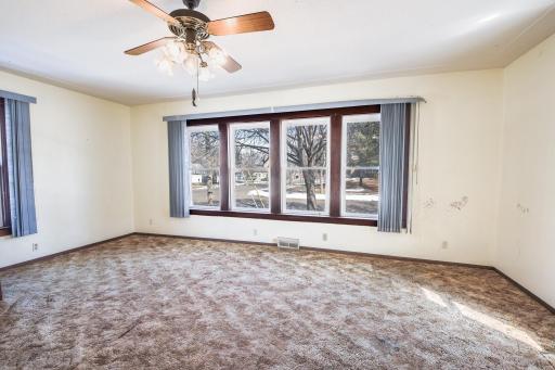 Living room filled with sun and updated windows.