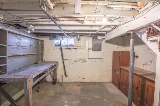 Plenty of storage in the basement as well as shelving and workbench.