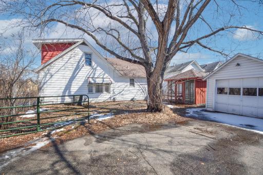 Enjoy the fenced in backyard with 2 car detached garage.